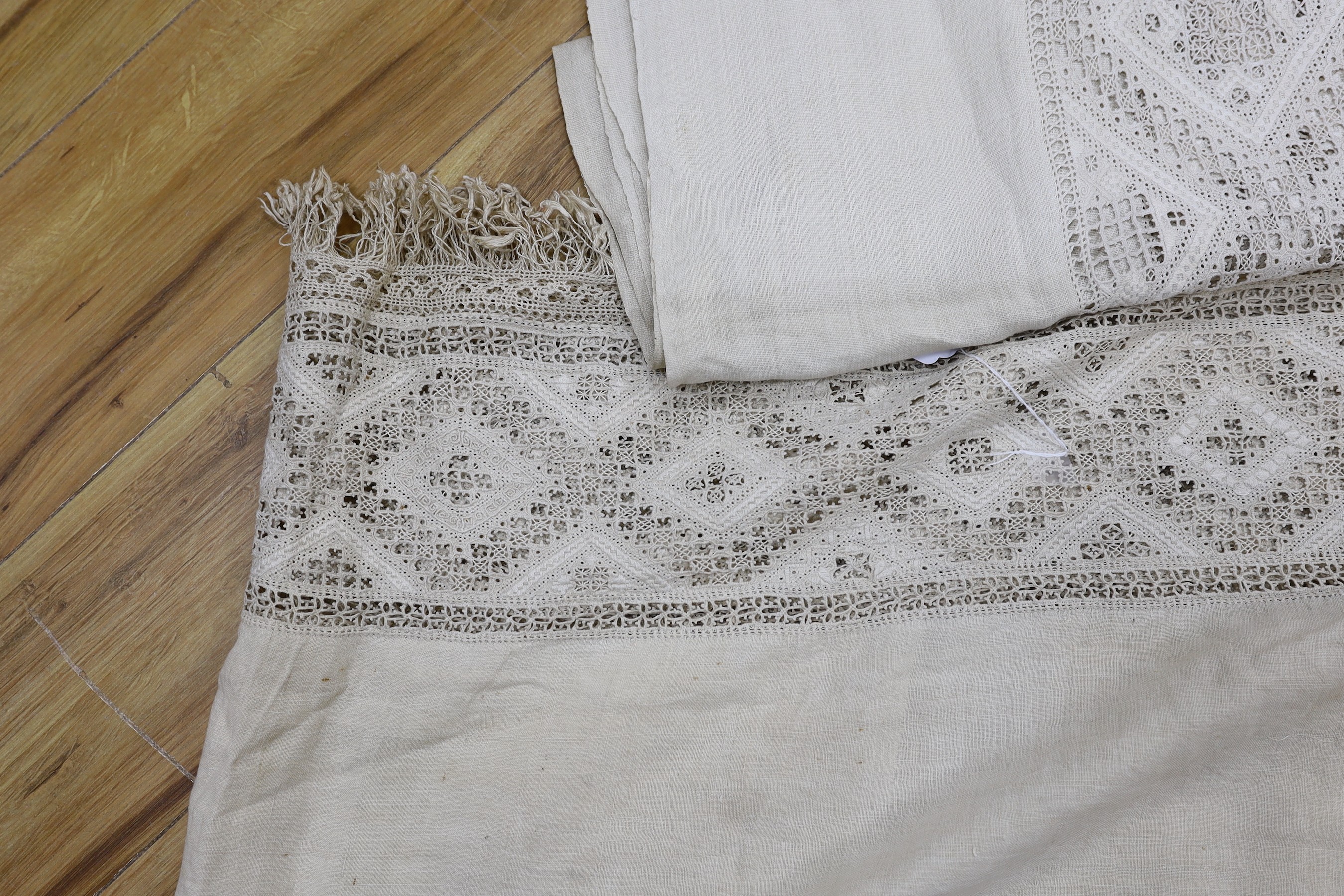 A pair of 19th century Greek hand worked and embroidered linen pelmets, 440cms long (each)